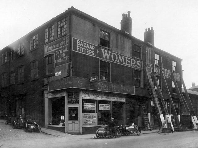 Woodhouse Lane in August 1929. On the left is the junction with Back Rockingham Street. Next, moving to the right is the premises of Pointing Ltd, motor car agents and dealers in Scott motor cycles. Then and occupying the upper floors, is Womersley and Co Ltd bazaar fitters and suppliers of marquees, awnings, ballroom decorations. It is followed by William Primley, tailors shop. Next is Miss Elsie Morris, milliner. The Albion Brewery is on the right. After this property was demolished the site was used for a static water tank during the war years. It is now part of the Merrion Centre.