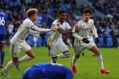 IN THE HAT: Leeds United after the late drama at Cardiff City, above. Photo by GEOFF CADDICK/AFP via Getty Images.