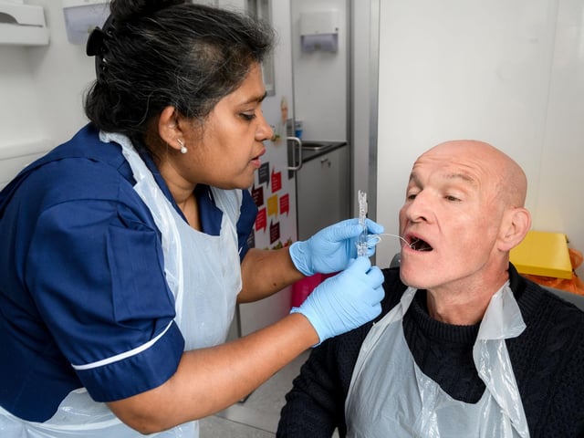 Richard Coyle having the "pill on a thread" test.