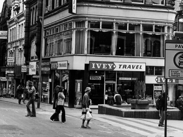 Lands Lane precinct at the corner with Albion Place. The fountain and precinct were opened on the April 12, 1972 by Environment Secretary Peter Walker. From the left, on Albion Place, shops include Bailey's, Nicola Anne, Willerby, Royce Manshop Ltd at number 27, Brandon House Ltd jeweller's at 28 and Ivey Travel at number 6 Lands Lane. A sign in the foreground informs that Lands Lane is a paved zone with vehicle restrictions.