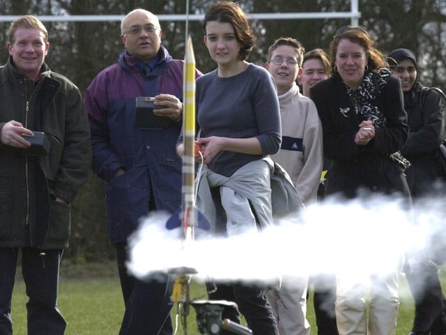 Sian Davis from Oakbank School, Keighley, launches a rocket as part of National Science week, at the playing fields on Woodhall Lane, Pudsey, on March 20, 2001.