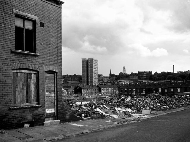 Woodhouse's Marian Terrace pictured in July 1975 during the process of demolition. On the left is still standing so far but houses to the right of it have been reduced to rubble. With all the Marian streets behind having already been demolished (though Marian Road at right angles to it on the right remains) there is a clear view through to Holborn Towers multi-storey flats, with one of the Jubilee streets still there in front of it. The Parkinson tower of Leeds University is seen in the background.