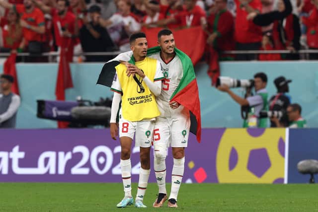 Morocco's midfielders #08 Azzedine Ounahi and #15 Selim Amallah celebrate winning the Qatar 2022 World Cup Group F football match between Canada and Morocco at the Al-Thumama Stadium in Doha on December 1, 2022. (Photo by Fadel Senna / AFP) (Photo by FADEL SENNA/AFP via Getty Images)