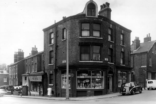 Warwick Street can just be seen on the left. Moving right is Blundell Street, number 15 is the Post Office. It is called 'Caledonian Road P.O.', run by J.(?). Dawson. At the road junction is Nelson's chemist shop. This is number 1 Caledonian Road, next 3 is a tobacconists. Blundell Terrace is on the right.