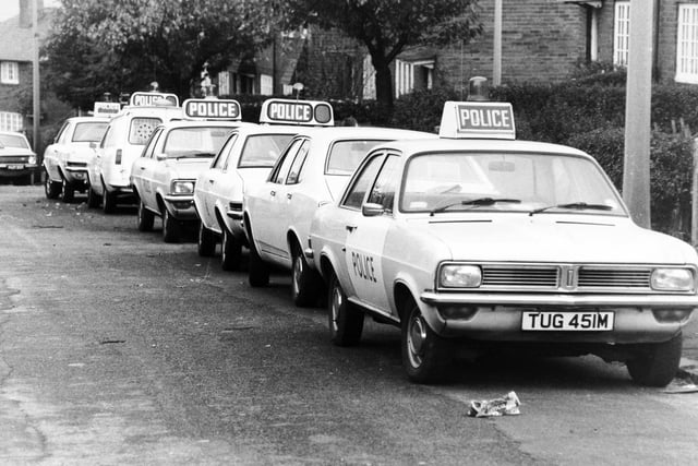 A line of police cars on Scott Hall Avenue in October 1975.