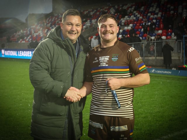 Man of the match Craig McShane receives his man of the match award from former top referee Ben Thaler after Hunslet ARLFC's win against West Hull in the National League Premier Division Grand Final at Wakefield Trinity.