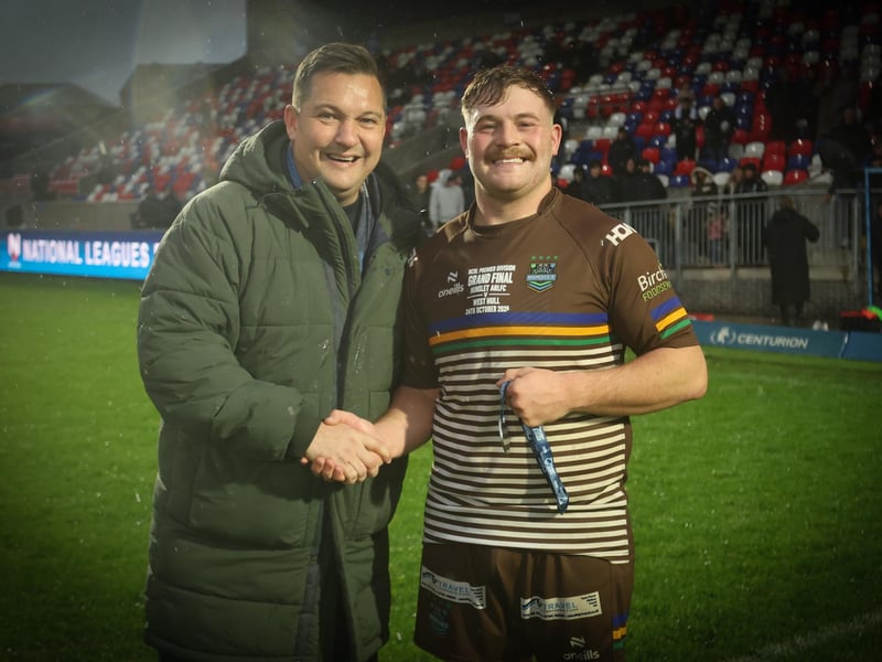 Man of the match Jack McShane receives his man of the match award from former top referee Ben Thaler after Hunslet ARLFC's win against West Hull in the National League Premier Division Grand Final at Wakefield Trinity.