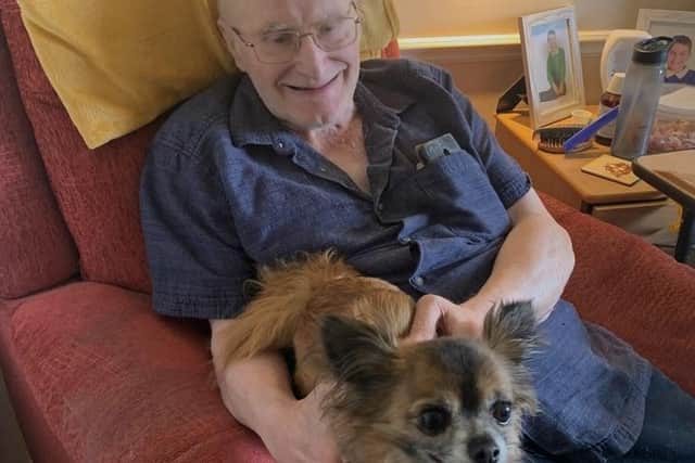 Priory Gardens resident Anthony Athorn with therapy dog, Luca