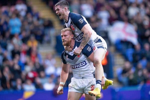 England's Luke Thompson, left, celebrates his try against France with John Bateman. Picture by Allan McKenzie/SWpix.com.