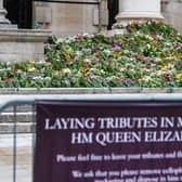 Florial tributes in memory of HM Queen Elizabeth II on the steps of Leeds Civic Hall and inside a book of condolence for members of the public to sign.