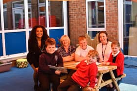 Some of the Whitley & Eggborough Community Primary School pupils in their new outdoor library with (back, from left) Jamilah Hassan of the Banks Group, school business manager Diane Steward and headteacher Alison Coventry