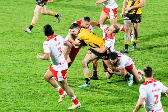 Josh Hodson - seen being tackled by Elliot Minchella, Jez LItten and Tyrone May during Castleford Tigers' defeat at Hull KR in February - has been drafted into the squad for Saturday's return. Picture by Allan McKenzie/SWpix.com.