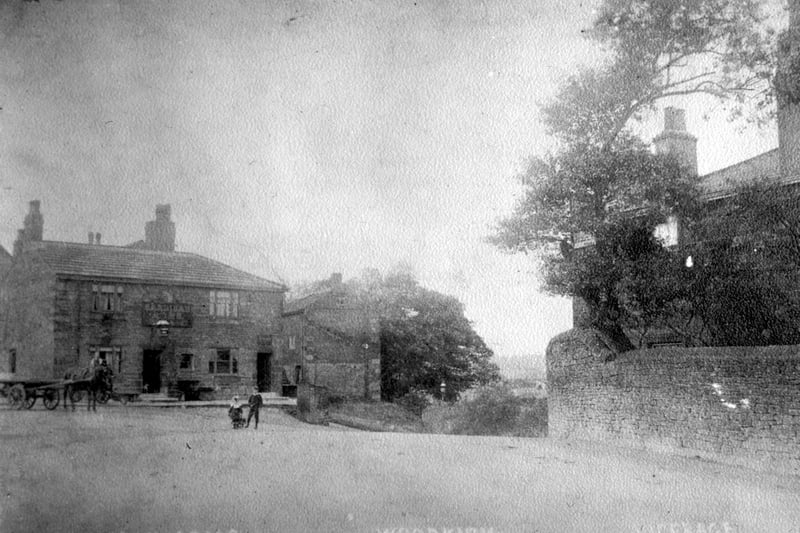 The original road bend showing the Cardigan Arms with the Woodkirk old vicarage on the right. Pictured in the 1920.