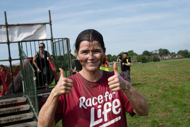 Thumbs up at Pretty Muddy for Cancer Research UK