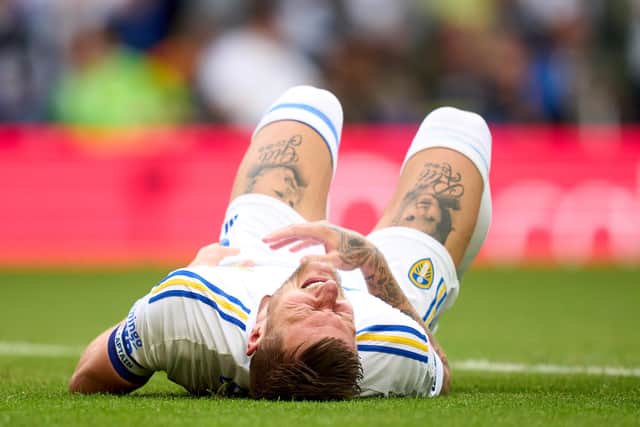 LEEDS, ENGLAND - AUGUST 06: Liam Cooper of Leeds United picks an injury after scoring his team's first goal during the Sky Bet Championship match between Leeds United and Cardiff City at Elland Road on August 06, 2023 in Leeds, England. (Photo by Alex Caparros/Getty Images)