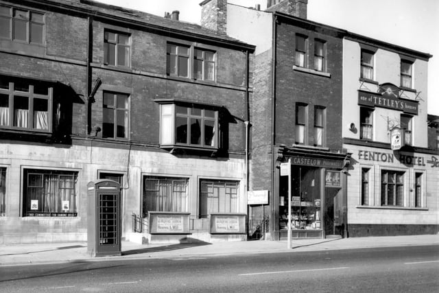 Woodhouse Lane in March 1966. To the left is listed as the National Deposit (Approved) Friendly Society with the Photocraft Studios at number 157a, the entrance is down a flight of steps. Number 159 is a pharmacy, business of Walter Thomas Castelow who took over these premises in 1904 and until his death in 1974 was the oldest working pharmacist in Leeds, still practising at the age of 97. The Fenton Hotel at number 161 was built in 1853, at the time of this view the landlord was Herbert H Baxter.
