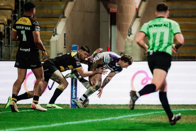 Tom Johnstone scores the first of his two tries for Wakefield Trinity in Friday's win at York Knights. Picture by Alex Whitehead/SWpix.com.