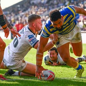 Playing from behind: Castleford Tigers players can only watch in despair as Kelepi Tanginoa scores another Warrington try.