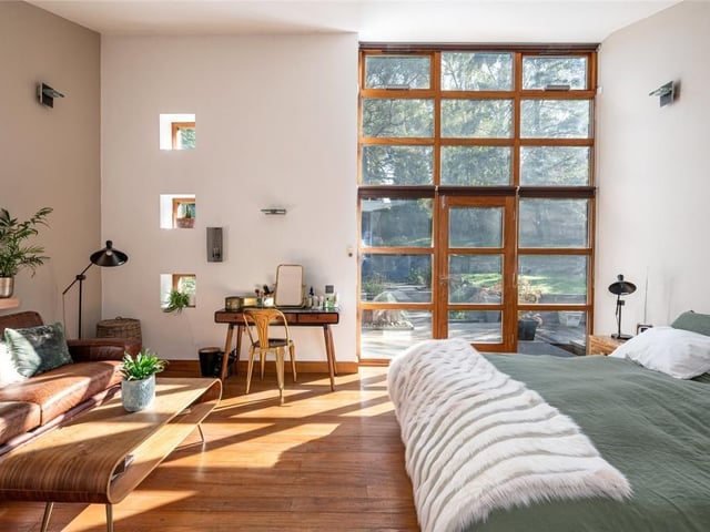 The master suite offers a full height curtain wall, whilst providing access to the private rear garden and is serviced by its own en-suite bathroom.