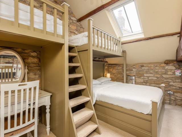 The barn annexe interior has both comfort and character, as with this mezzanine sleeping area.