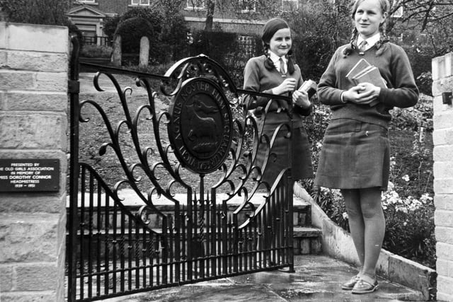 Two pupils at Fulneck Girls' School - Christine Rutley, left, and Diane Gregson  - at a memorial gate to Dorothy Connor in the school gardens in May 1971.