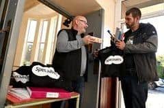 Tony Wing, VCHP Project Manager handing out care packages for people visiting the drop in session