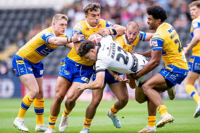Leeds Rhinos' James McDonnell, Presley Cassell, Jarrod O'Connor and Kallum Watkins gang up on Hull FC's Lewis Martin in the 34-0 away win two weeks ago. Picture by Allan McKenzie/SWpix.com.