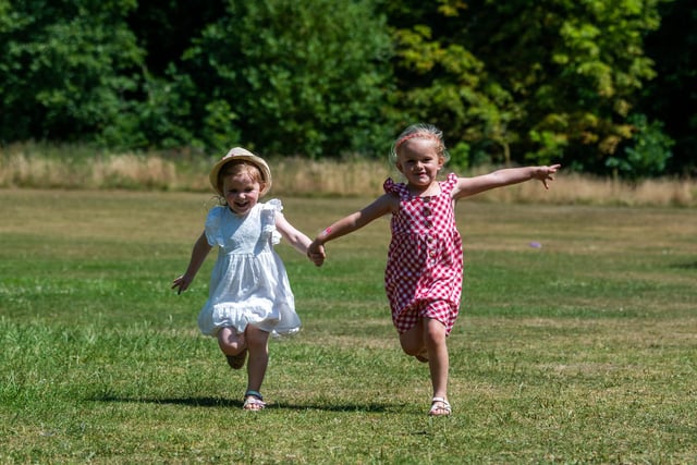 Who wouldn't want to live near Roundhay Park? The area features 11th on the list, with 61.5 per cent of its 2,318 households living in relative comfort. Pictured are friends Sophie Catton, 4, and Mabel Womersley, 4, having fun in Roundhay Park during the summer.