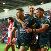 Chris Hankinson, second from right, celebrates with Jake Connor, Ash Handley and Harry Newman after scoring Leeds Rhinos' opening try in the 34-6 win at St Helens. Picture by Paul Currie/SWpix.com.