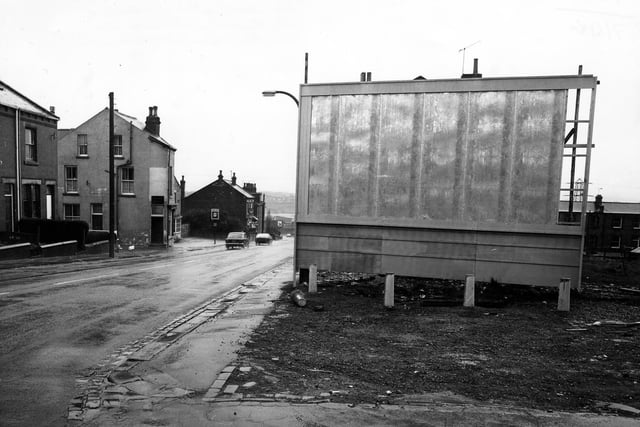 Looking north-east along Elland Road from the junction with Little Lane in May 1980. In the foreground is a blank advertising hoarding. On the left are no.s 26-20 Elland Road followed by the New Inn public house.