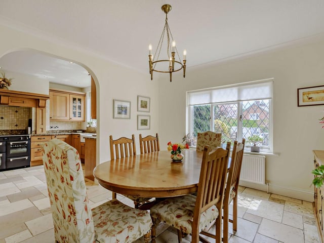 The kitchen leads through to the dining room, through an open archway.