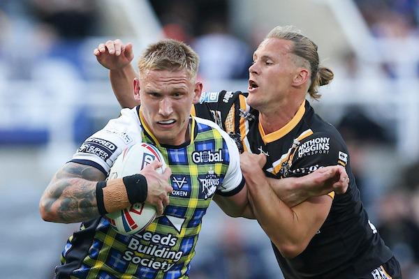 Leeds Rhinos' Mikolaj Oledzki is tackled by Castleford Tigers' Jacob Miller at Magic Weekend. Both scored a try, but Miller's side came out on top.