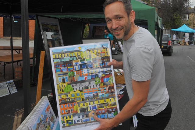 Local artist Richard Locket, a graphic artist, with his flat graphics picture of Chapel Allerton