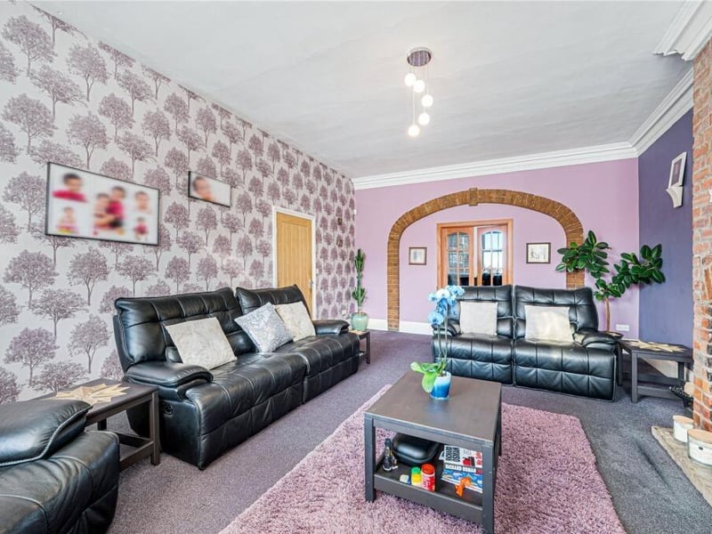 The living room provides a generous, comfortable space for family time, with proportions suited to both everyday use and entertaining.