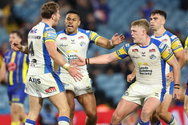 Leeds Rhinos' Paul Momirovski , left, celebrates his Magic Weekend try against Warrington Woles, with Dave Fusitu'a, James McDonnell and Jack Sinfield. Picture by John Clifton/SWpix.com.