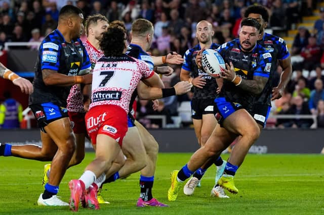 Harry Newman's offload sends James Bentley in for a try during Leeds Rhinos' win at Leigh Leopards. Picture by Olly Hassell/SWpix.com.