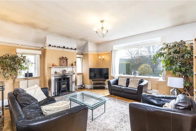 There is a gorgeous lounge and sitting room with a fireplace and plenty of natural light.