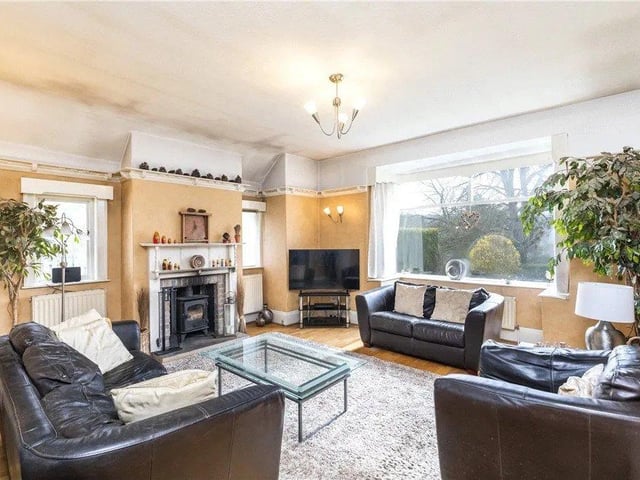 There is a gorgeous lounge and sitting room with a fireplace and plenty of natural light.