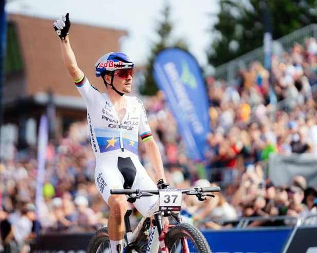 Tom Pidcock celebrates a solo win in the  Men Elite XCO round of the UCI Mountain Bike World Series in the Czech Republic.