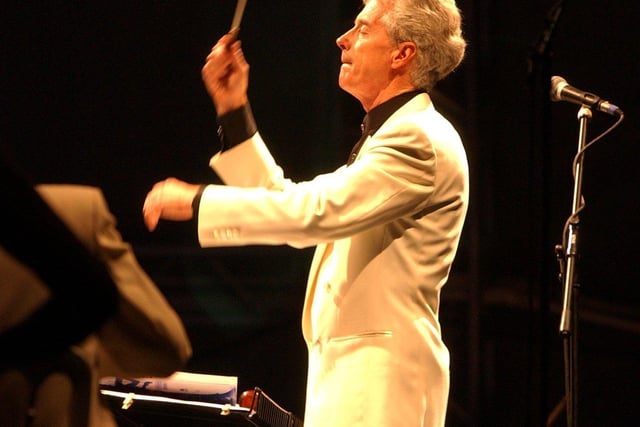 John Pryce-Jones conducts the orchestra at Classical Fantasia in September 2003.