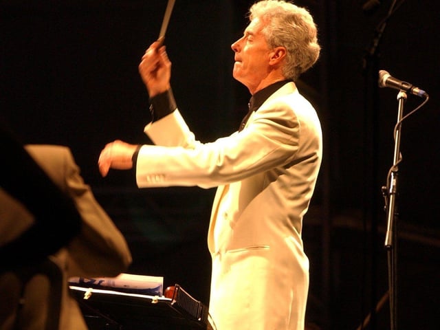 John Pryce-Jones conducts the orchestra at Classical Fantasia in September 2003.