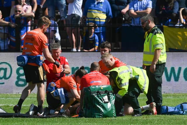 Leeds' Danny Levi is treated on the field after being knocked out against Castleford Tigers. Picture by Matthew Merrick/SWpix.com.