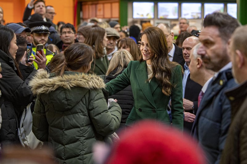 Kate arrived at the market at about 11.30am and greeted members of the public who had queued up to see her