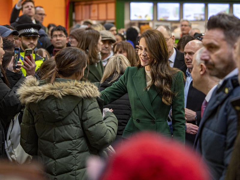 Kate arrived at the market at about 11.30am and greeted members of the public who had queued up to see her