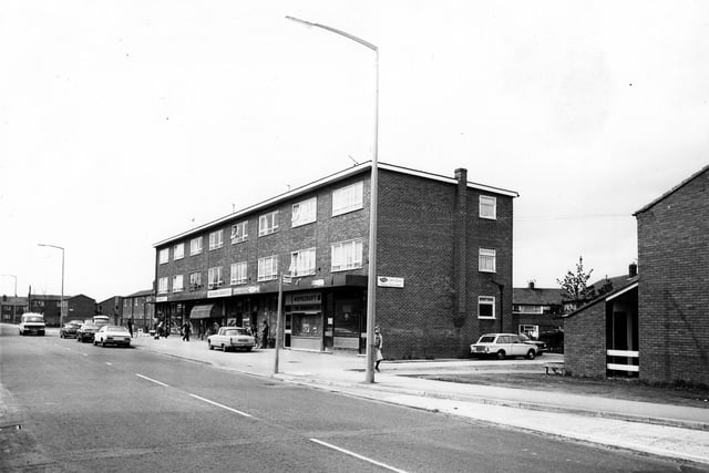 A parade of shops on Upper Town Street pictured in May 1979 including F. Moss, fish and chips, Hopecroft Turf Accountants, Severn Sports, and B.Field. On the right is the junction with Bell Road.