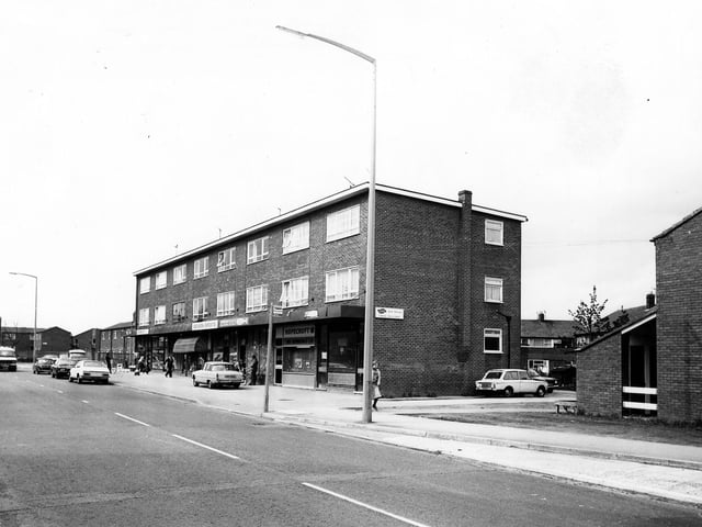 A parade of shops on Upper Town Street pictured in May 1979 including F. Moss, fish and chips, Hopecroft Turf Accountants, Severn Sports, and B.Field. On the right is the junction with Bell Road.