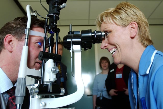 Alan Milburn officially opened St George's Centre, in Middleton in April 2003. Ophthalmic technician Tracey Grioli looks into his eyes on a visit to the eye clinic.