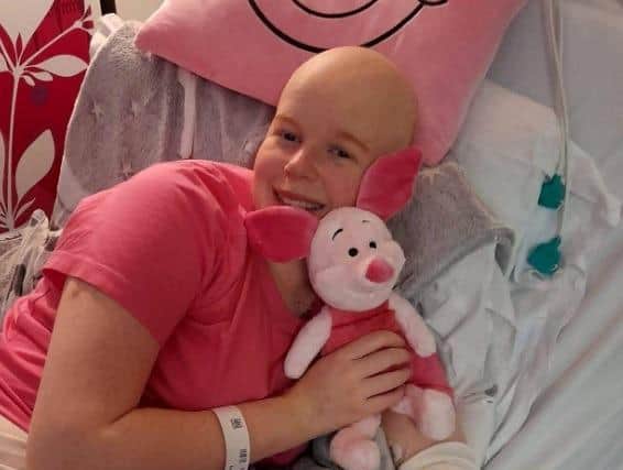 Emily during her previous stay in hospital as she underwent chemotherapy.