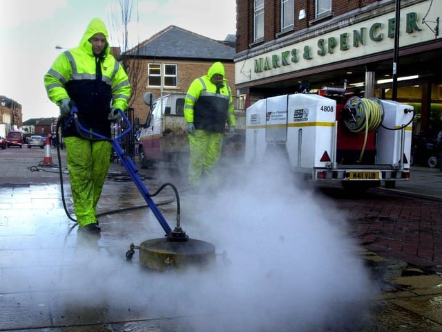 Operatives Paul Dean, left, and John Windmill using a 'Grimebuster' machine in Carlton Street, Castleford. Story Louise Male, pictured on February 26, 2002.