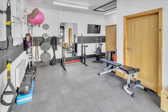 The property's double garage is currently being used as a Large Gym, Office and Store with electric heating.